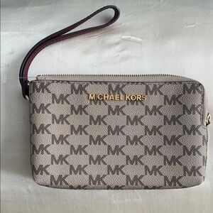 Michael Kors Gray Wallet with Monogram Pattern and Gold Accents